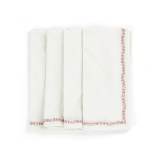 Embroidery servetter i vitt med rosa broderi.