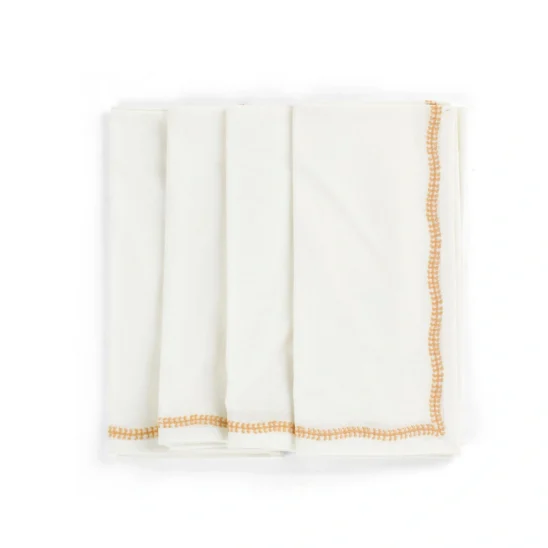 Embroidery servetter i vitt med orange broderi.
